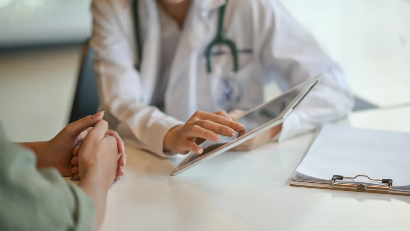 A physician reviewing care options with a patient (placeholder image).