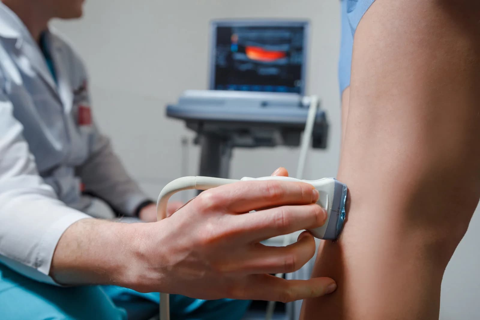 A venous ultrasound being performed on a patient's leg.